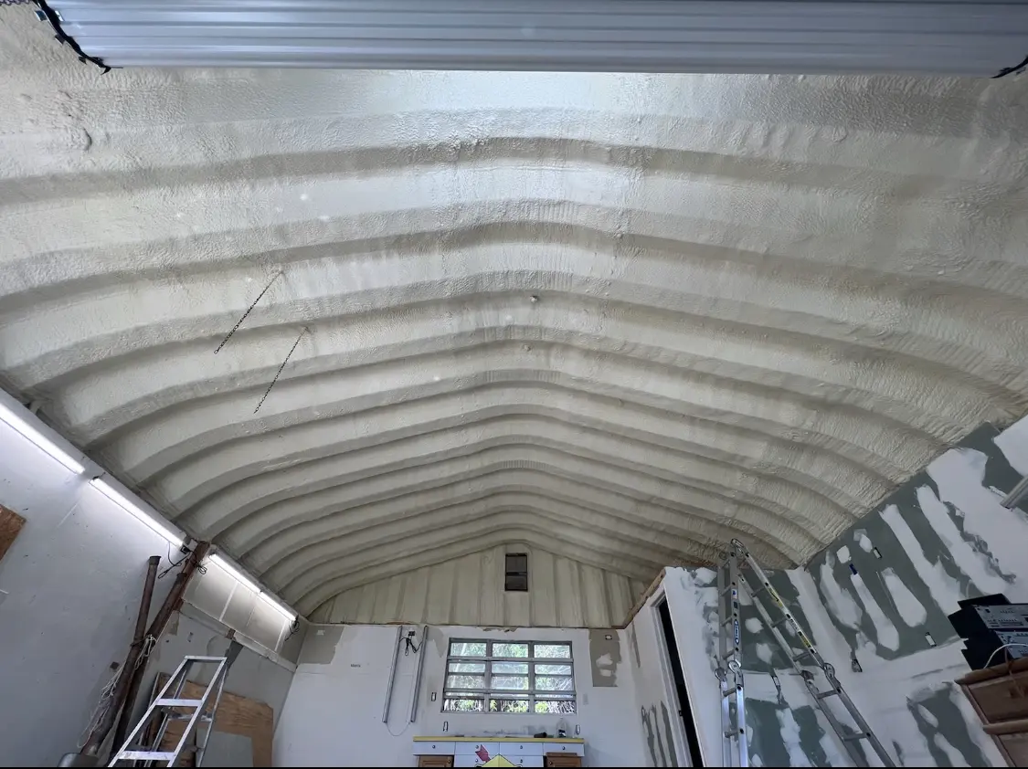 Spray polyurethane foam applied to the underside of a metal roof deck in Brawley